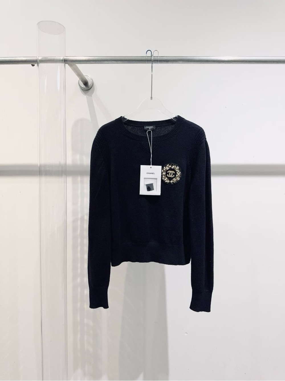 CHANEL Black Crewneck Sweater with Embellished CC Medallion